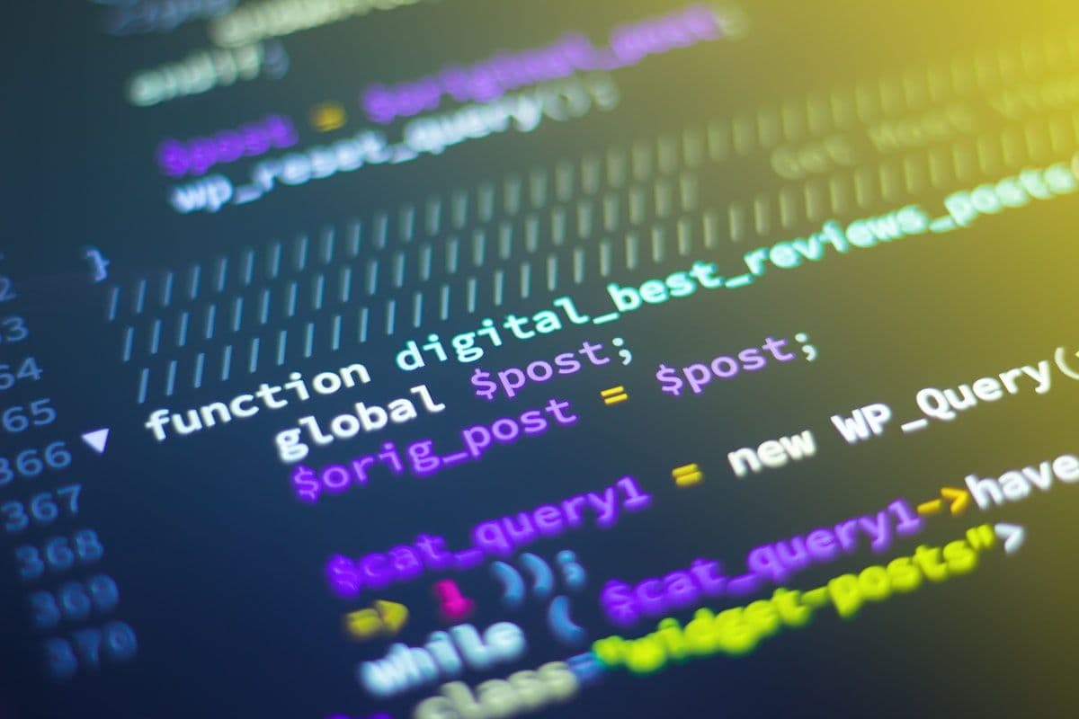 Developer reviewing secure code on a monitor with AI security analysis overlay